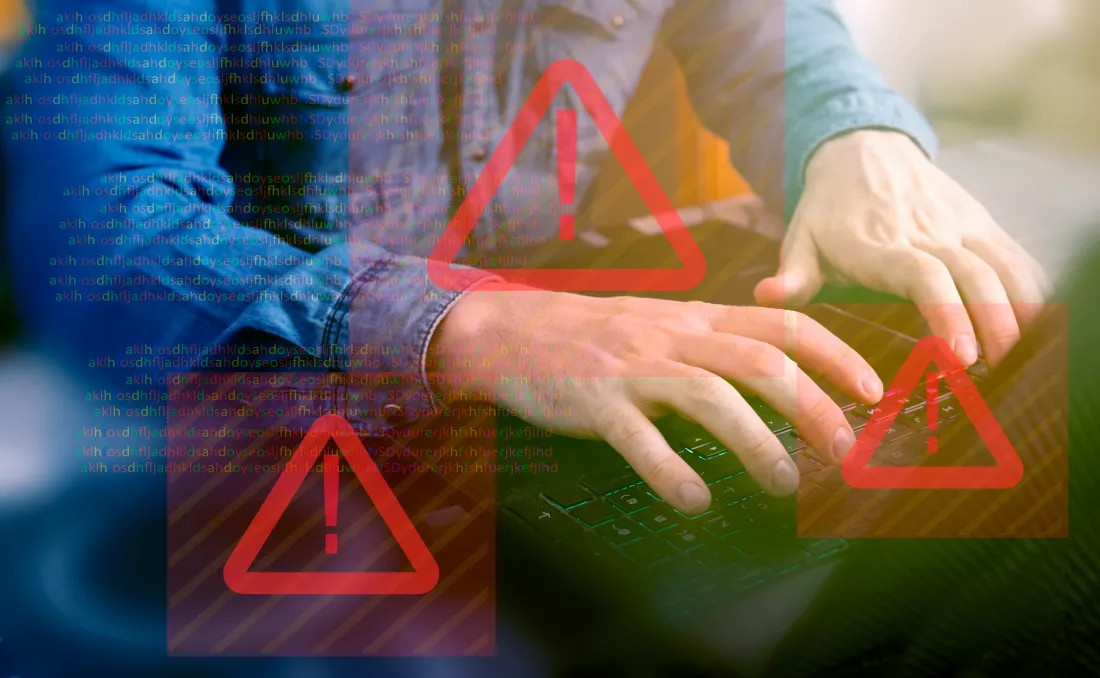 crop-person-using-laptop-symbols-error