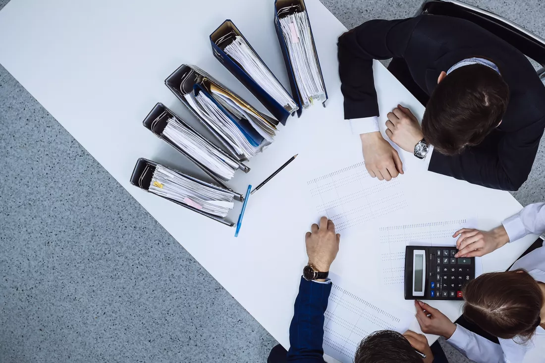 business-people-meeting-view-from-bookkeeper-financial-inspector-making-report-calculating-checking-balance-internal-revenue-service-checking-financial-document-audit-tax-conce